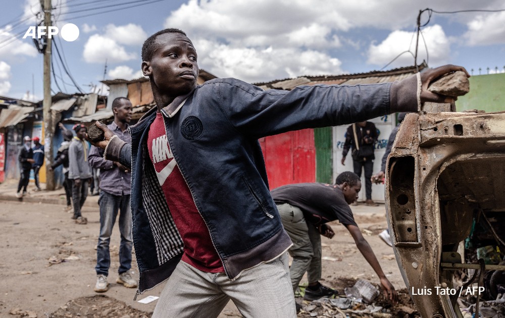 Opposition supporters throw stones towards Kenya Police Officers, Nairobi