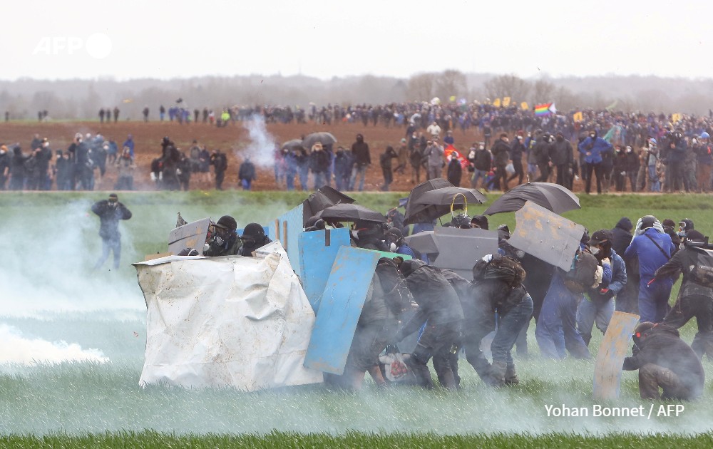 Protesters, surrounded by tear gas, against construction of ane water reserve for agricultural irrigation, Sainte Soline